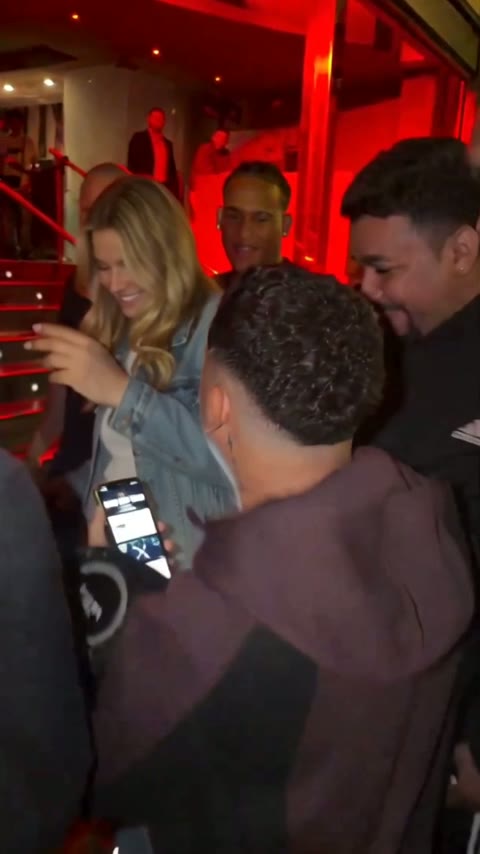 The rapper leaning back in to Kevin Wai's phone at the end of the cut