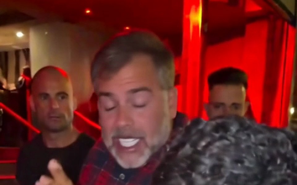 Dad with a gray beard and flannel shirt following the freestyle step by step
