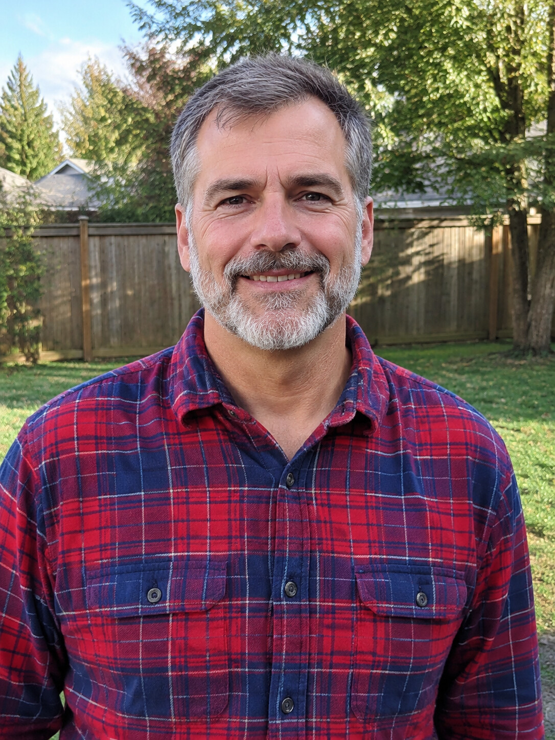The photo of a dad with salt-and-pepper hair and a gray beard in a flannel shirt that one sample was made from